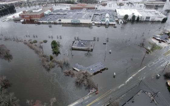 Floodwaters surround the Warwick Mall in Warwick, R.I., on Wednesday.
